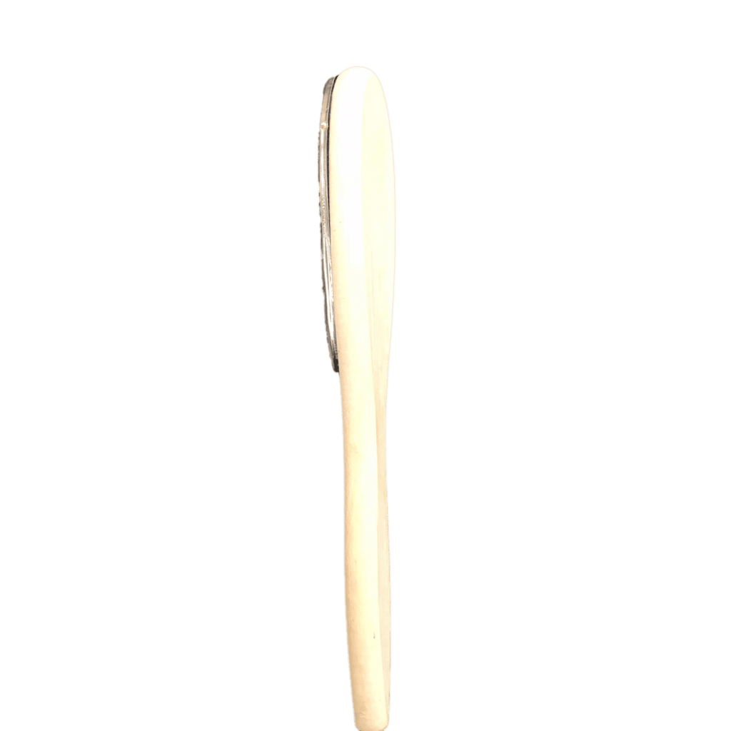 A professional UNIQUE extension brush with durable bristles for gentle detangling and grooming.