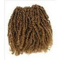 Unique's Human Hair Reggae extensions in rich brown with a natural bohemian texture