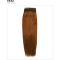Woman wearing natural deep black Unique Human Hair Yaki extensions with a minimalist aesthetic