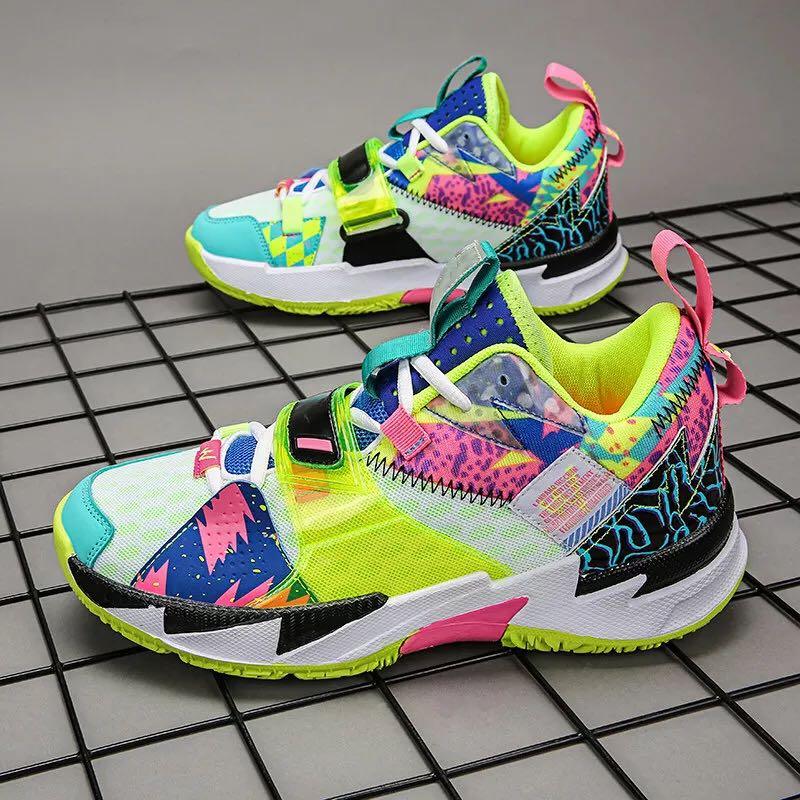 Unisex high-top rainbow basketball sneakers with durable rubber outsoles and breathable canvas fabric.