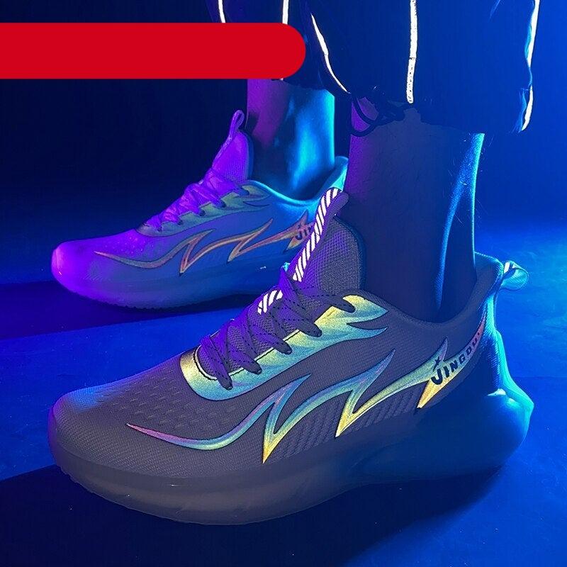 Unisex knit mesh sports sneakers with fluorescent accents in black, white, blue, and orange