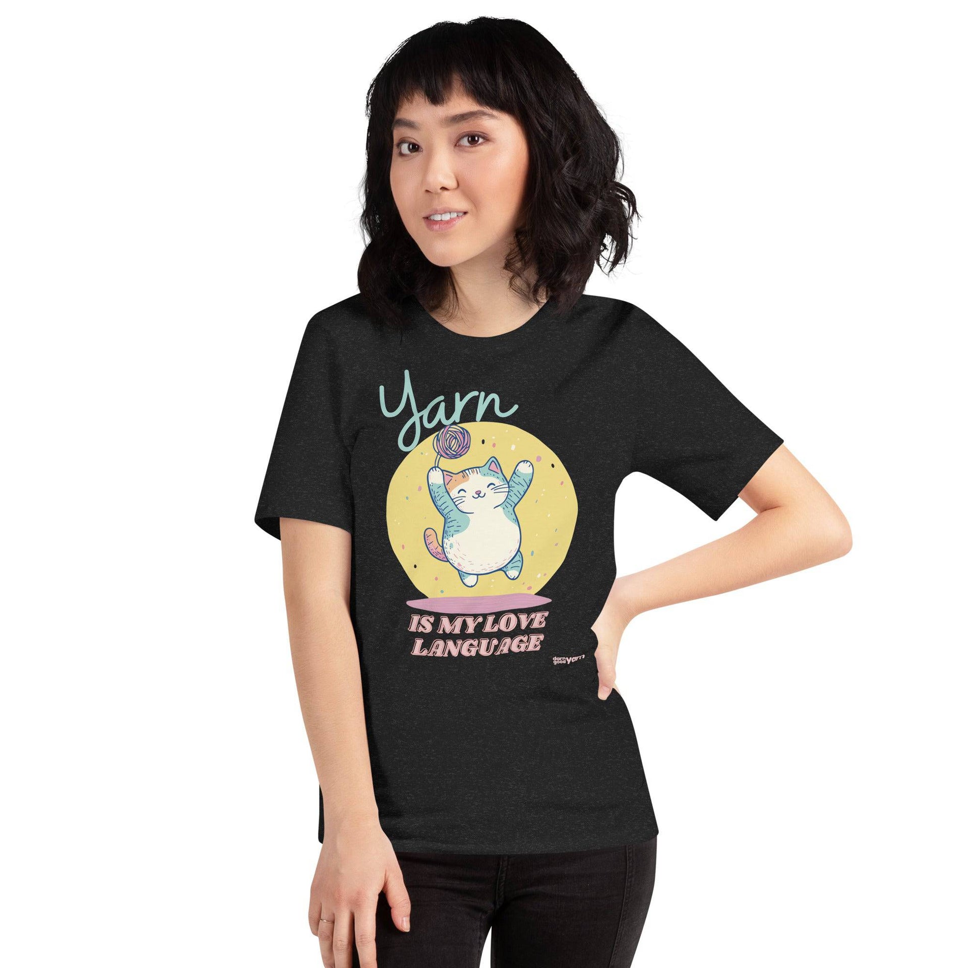 Happy cat tangled in colorful yarn on a graphic t-shirt