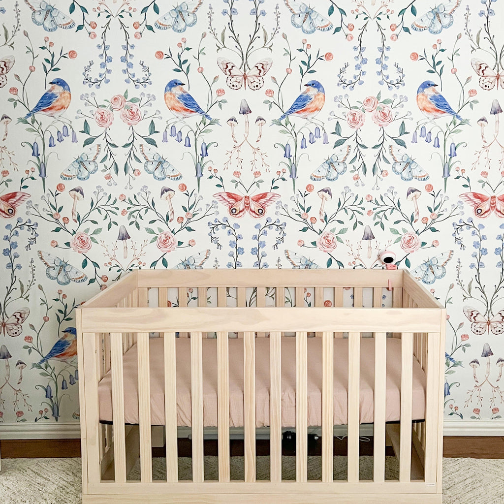 Hollis botanical floral wallpaper featuring white, blue, and pink colors.