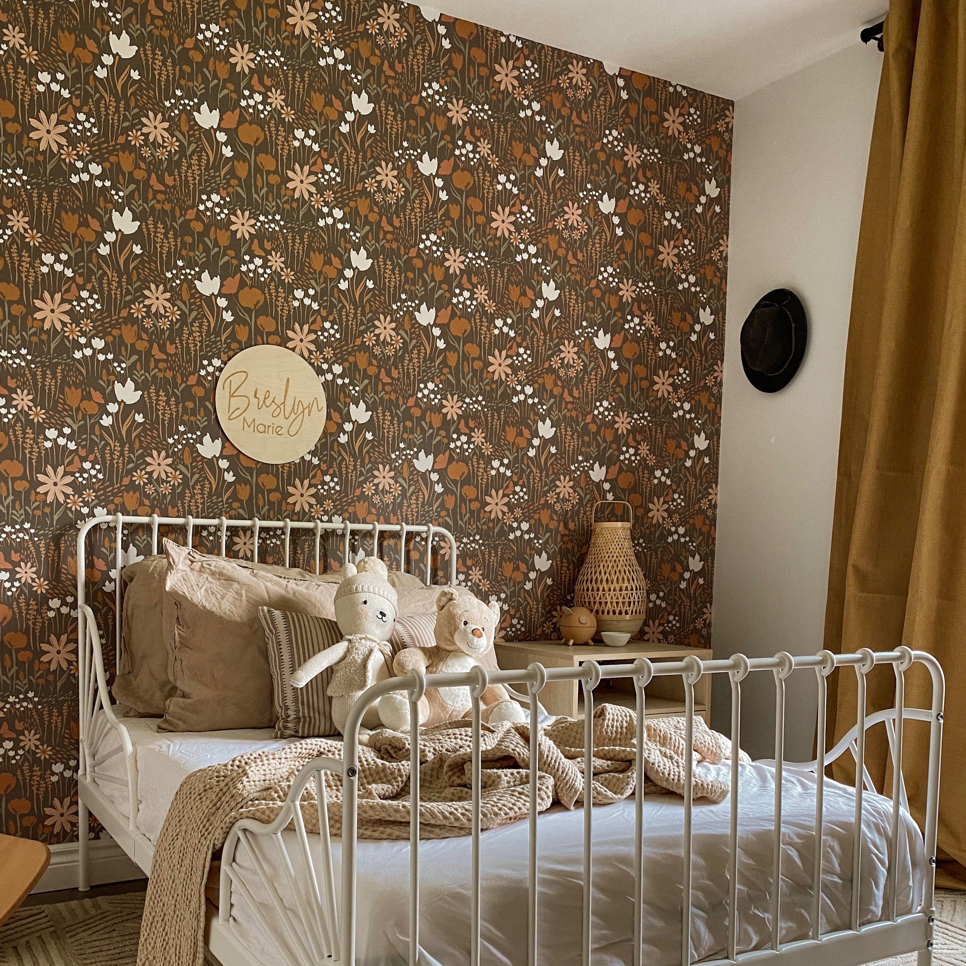 Eloise floral wallpaper featuring terracotta, brown, and cream patterns.