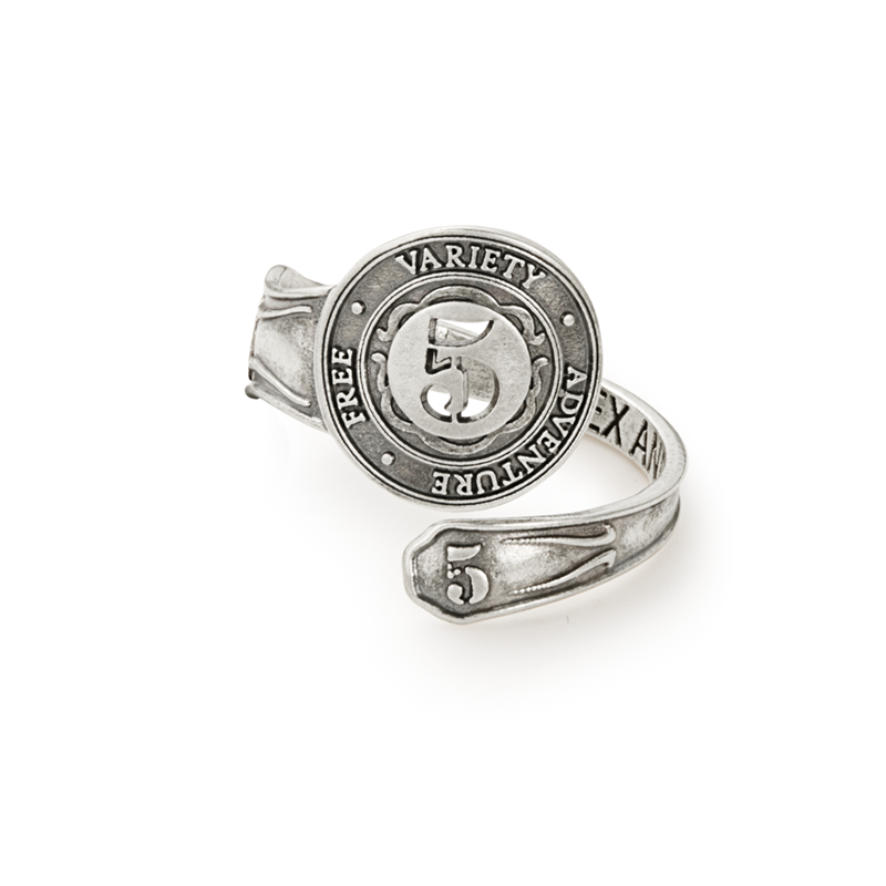 Antiqued silver spoon ring with intricate vintage detailing on a white background.