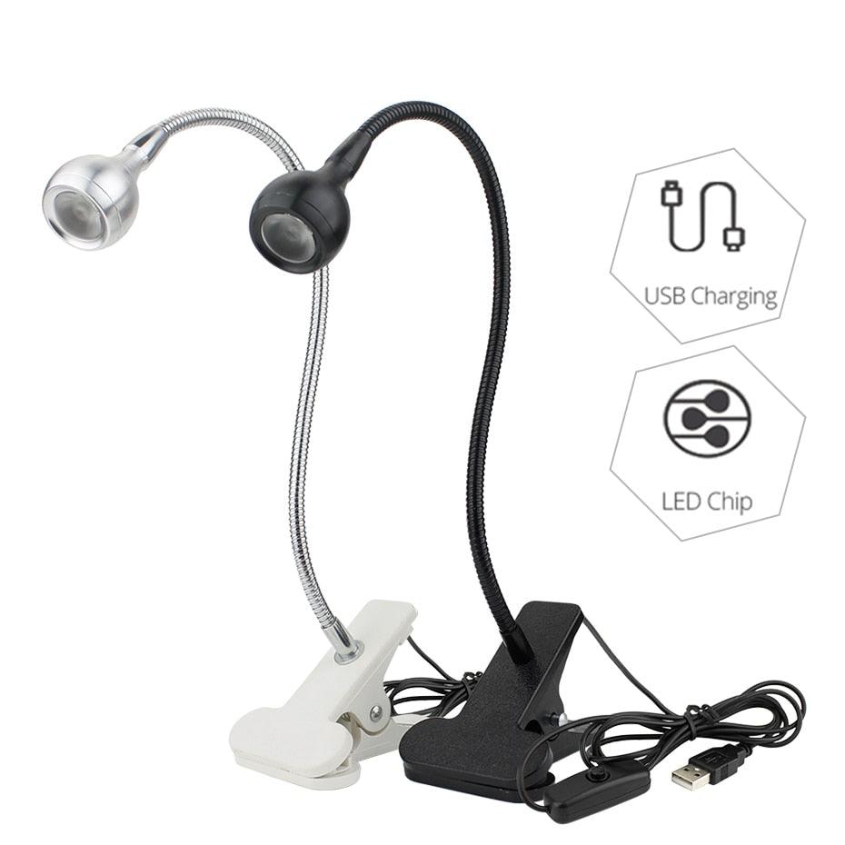 Modern flexible LED clip-on desk lamp available in black, silver, and white