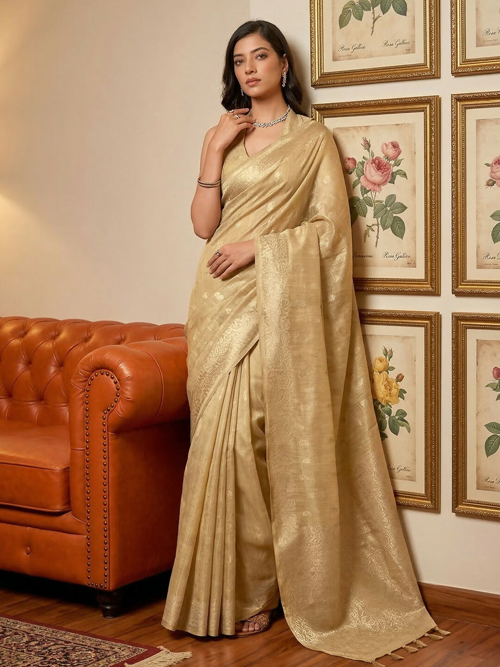 Elegant cream tissue silk saree with matching blouse piece, showcasing a delicate sheen and sophisticated ethnic drape.