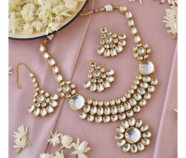 Handcrafted Kundan stone studded gold plated necklace and earring set