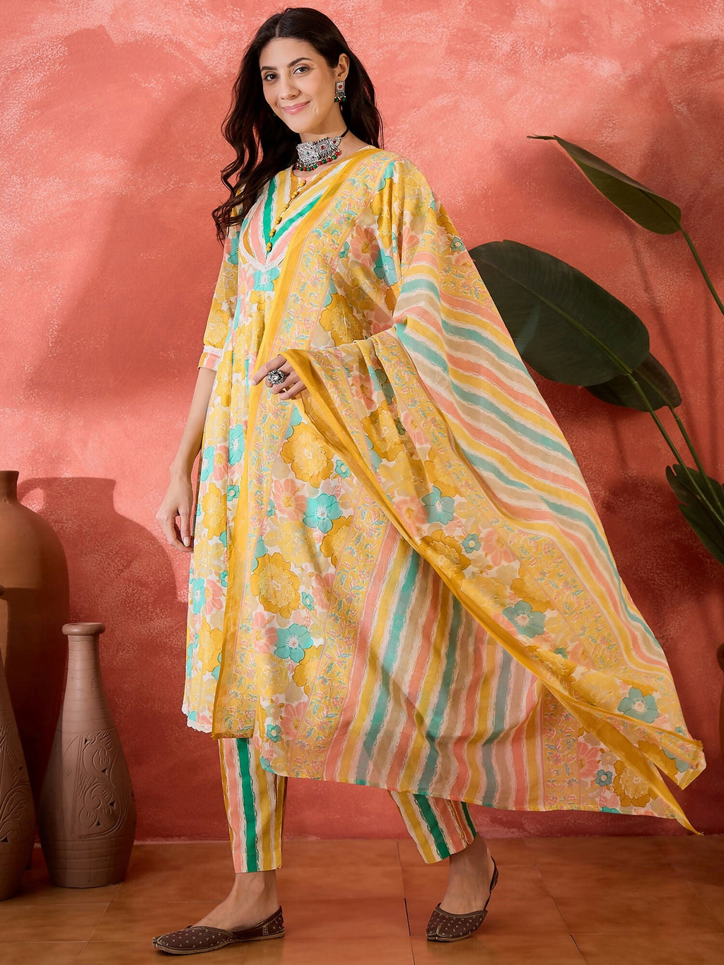Mustard printed pure cotton kurta set for women, perfect for ethnic festive occasions.