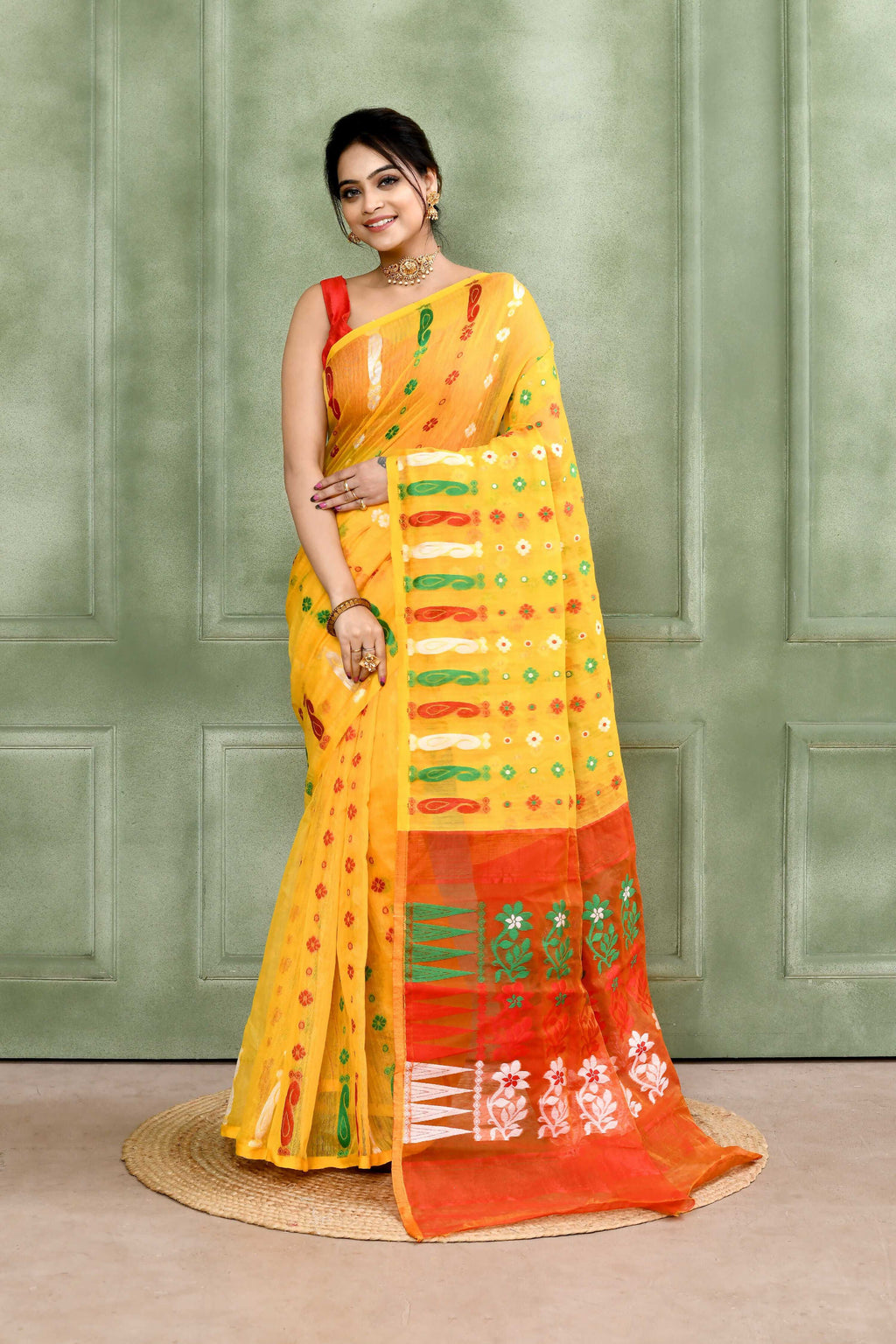 A beautiful yellow embellished cotton blend Jamdani saree with intricate detailing.