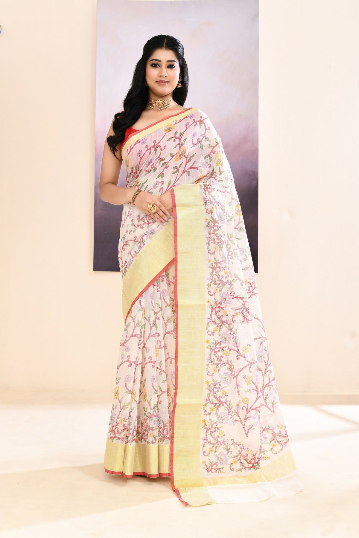 White embellished printed saree in cotton blend fabric draped elegantly