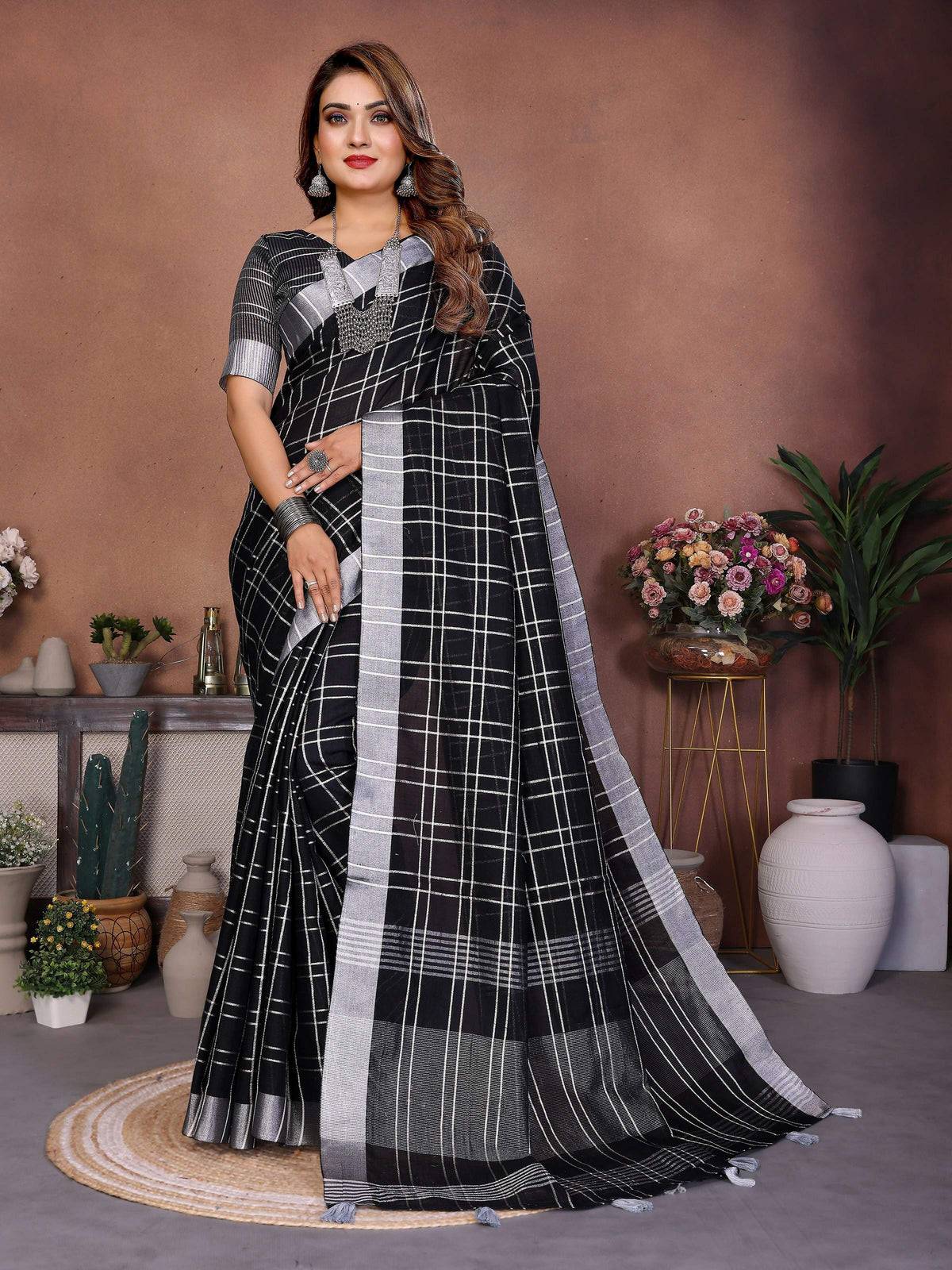 Elegant black linen saree with delicate weaving work