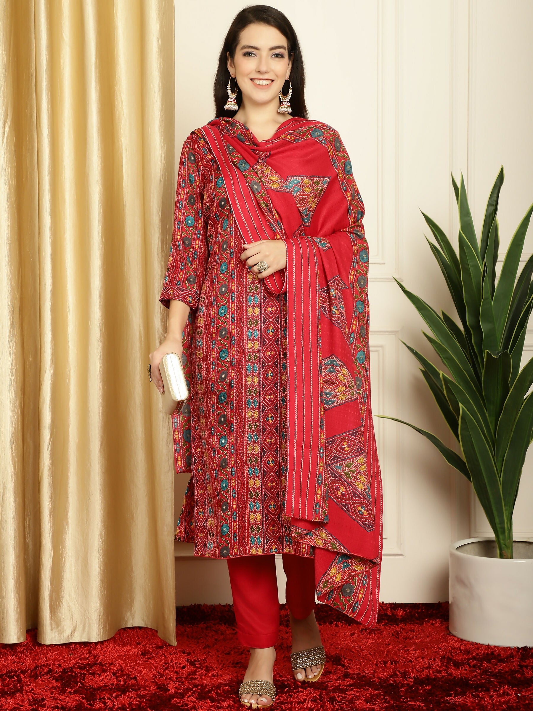 Woman wearing a red pashmina kurta with floral digital print, matching trousers, and a printed dupatta