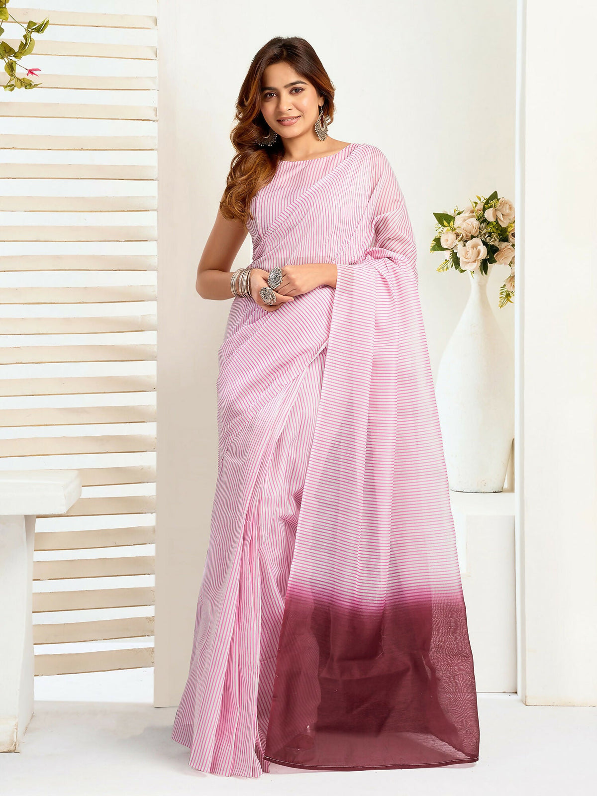 Light pink striped linen ready-to-wear saree with matching unstitched blouse piece.