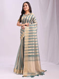 Elegant Green Organza Saree with matching blouse piece draped beautifully.