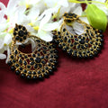 Sophisticated golden earrings with black beads, perfect for elegant evening wear