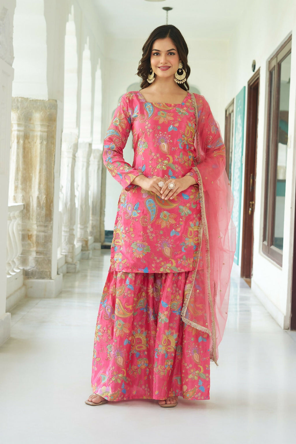 Lightweight pink Chinnon readymade kurta set with sequence detailing.
