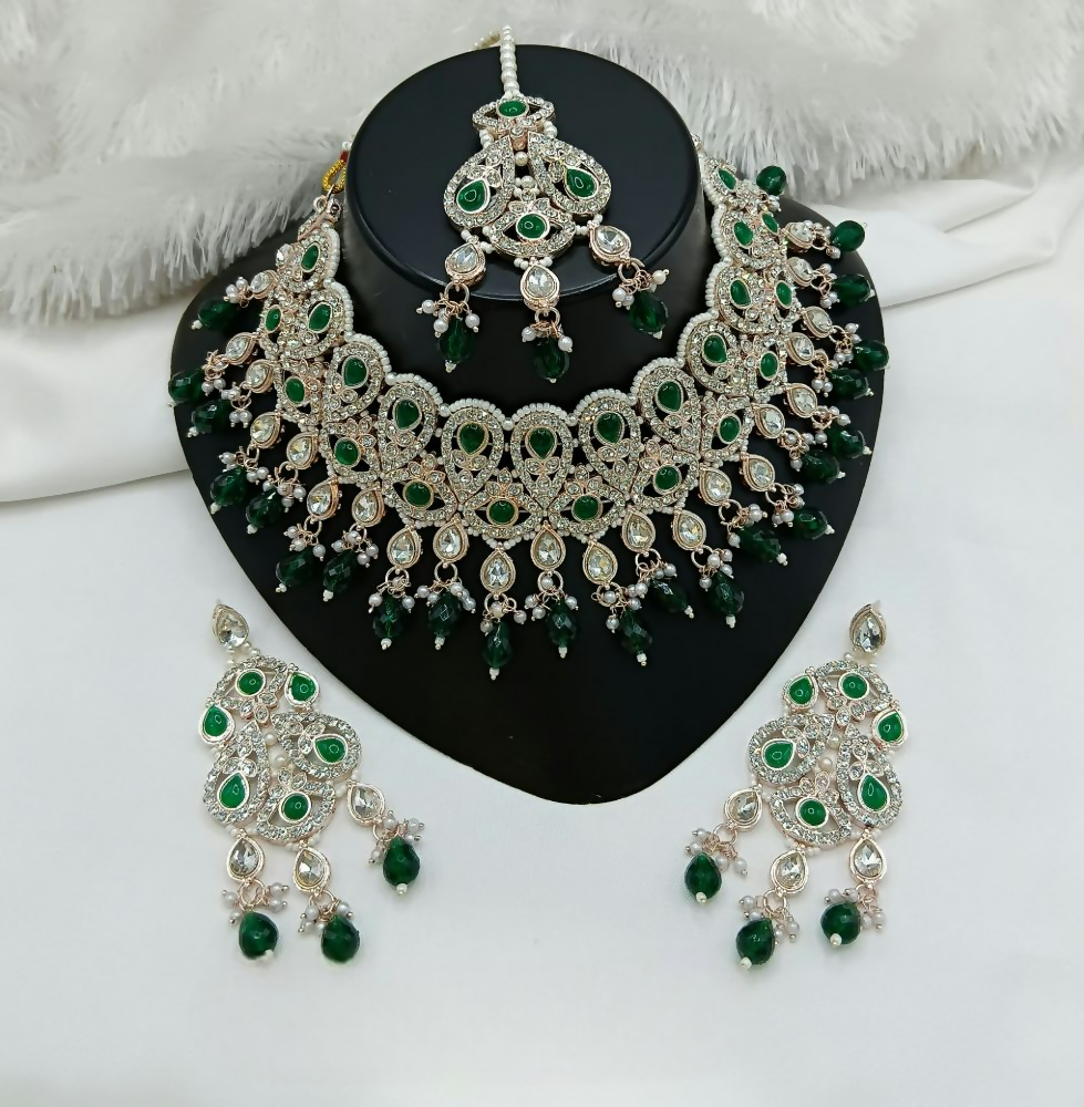 Elegant ruby color stone work statement necklace and matching earring set