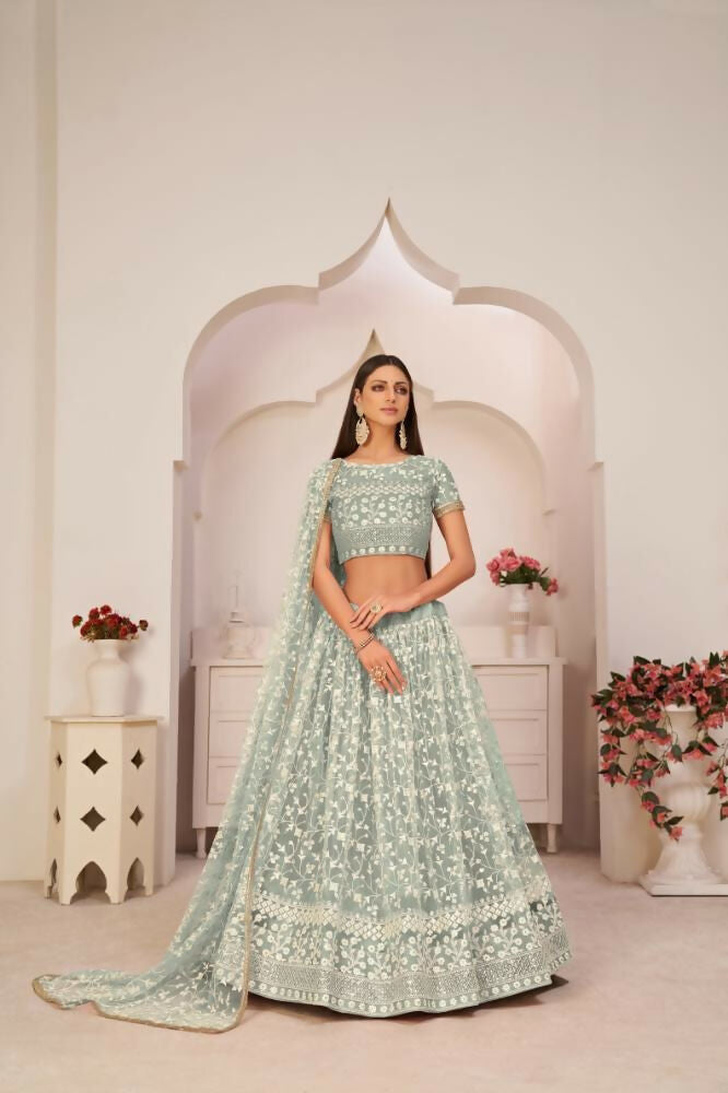 Turquoise Green Butterfly Net Lehenga with intricate zari and sandwich sequence embroidery