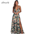 Model wearing a green sleeveless floral print maxi dress with a deep V-neck and high leg slit