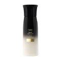Oribe Mystify Restyling Spray bottle in signature black and white packaging.