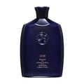 Bottle of Oribe Shampoo for Brilliance and Shine in deep purple and gold packaging.