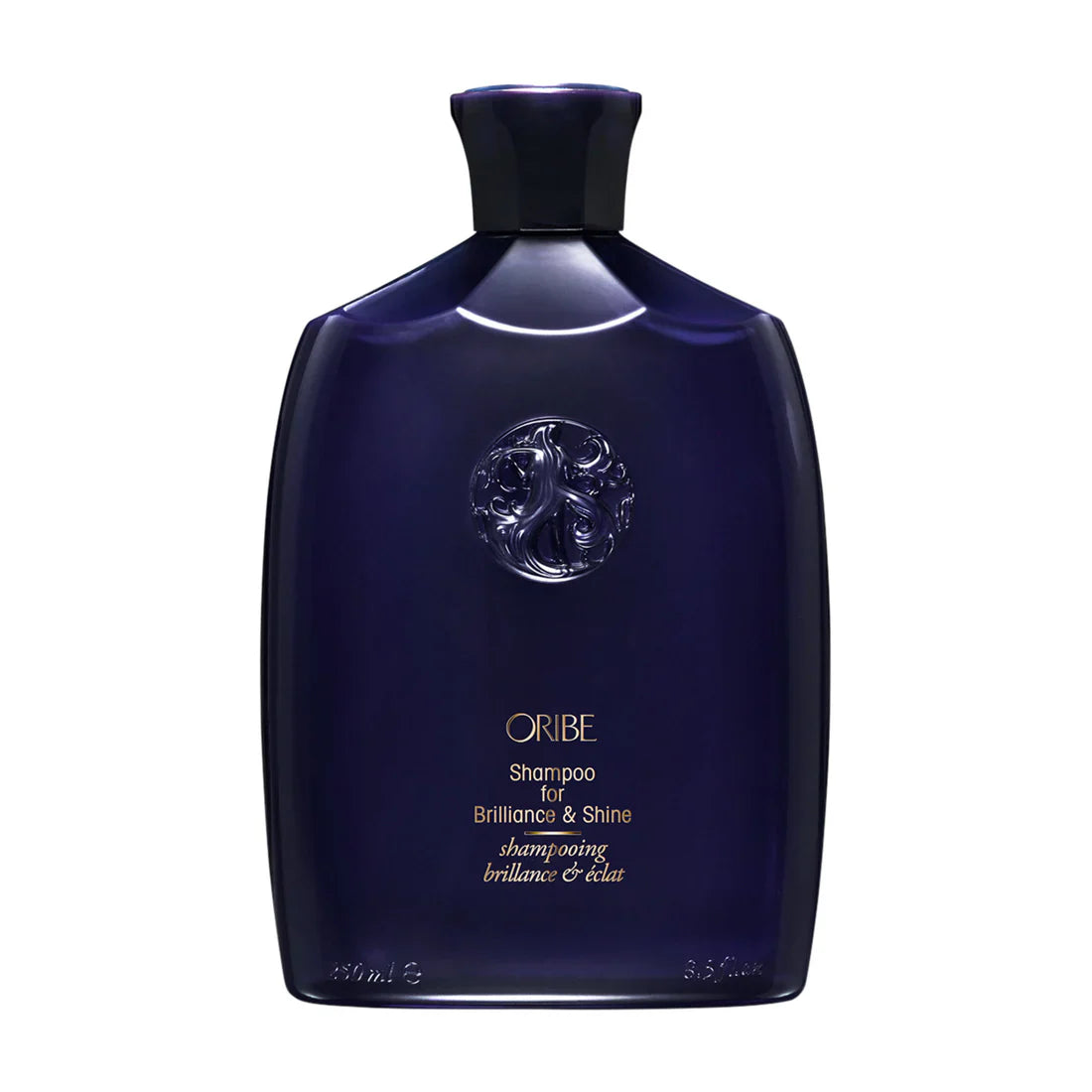 Bottle of Oribe Shampoo for Brilliance and Shine in deep purple and gold packaging.