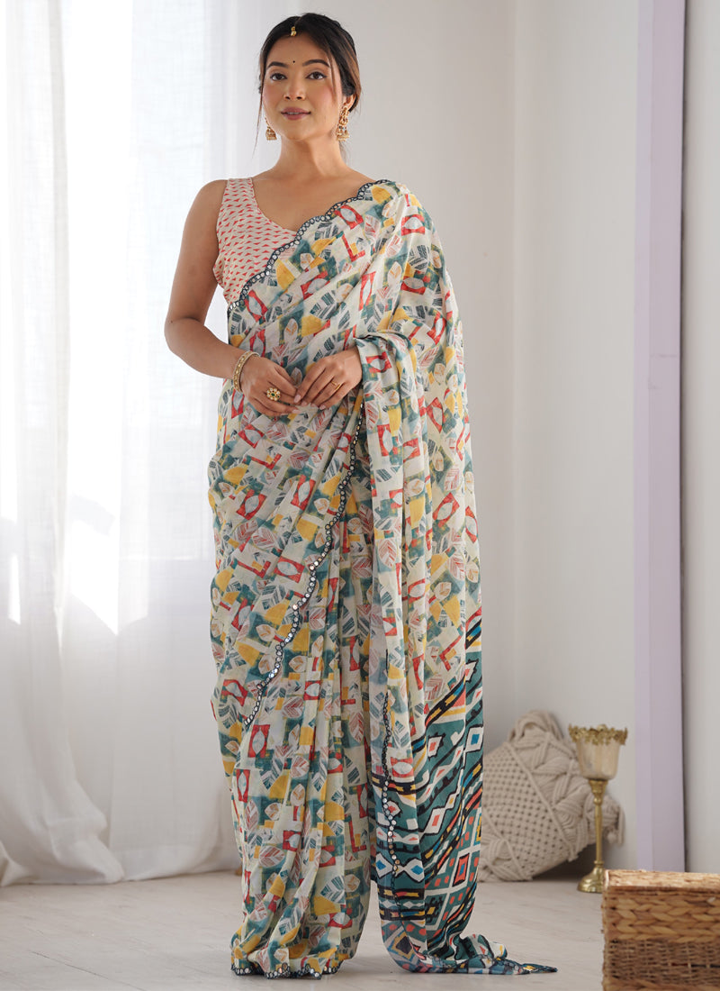 Off white Chinon silk designer saree with detailed print and mirror work border.