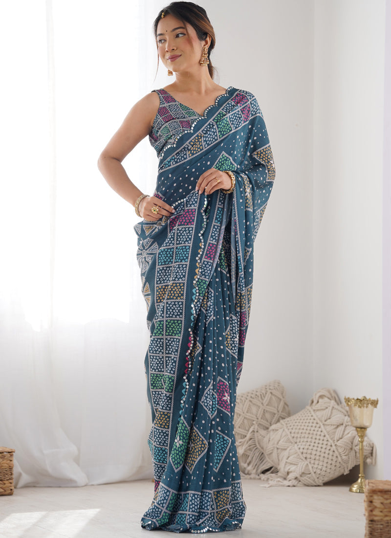 Blue Chinon silk designer saree with print and mirror work border.