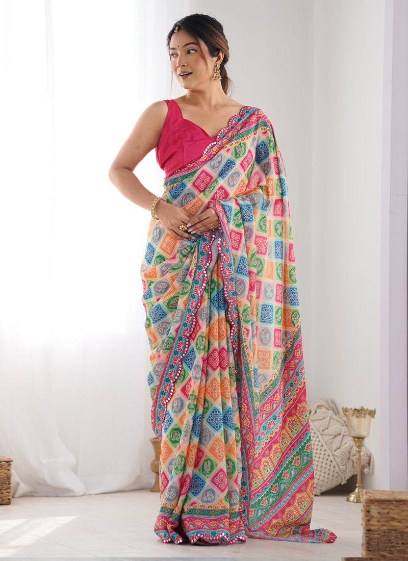 Multi-colored Chinon Silk saree with printed motifs and mirror-work border