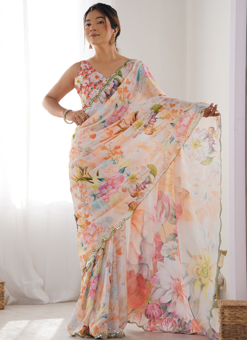 Off-white Chinon silk designer saree showcasing a detailed print and shiny mirror work border