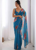 Sky blue georgette silk saree with intricate moti work border and printed pattern