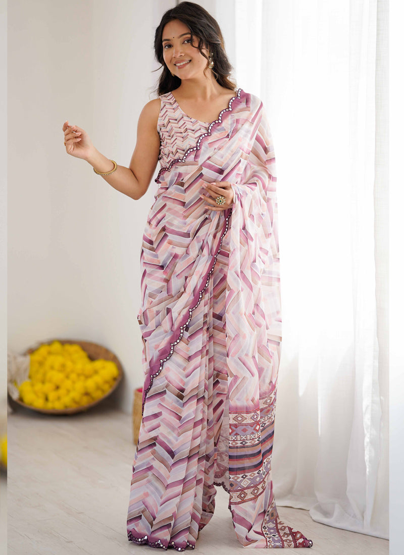 Model wearing a multi-color geometric print chiffon saree with mirror work border in lavender and plum shades