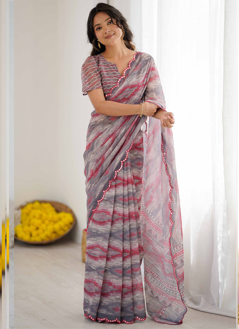 Multi-color chiffon designer saree with charcoal base, magenta brushstrokes, and intricate mirror-work border.