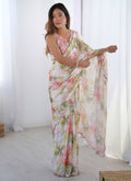 Off white and sky blue printed Chinon silk saree with a heavy decorative mirror work border