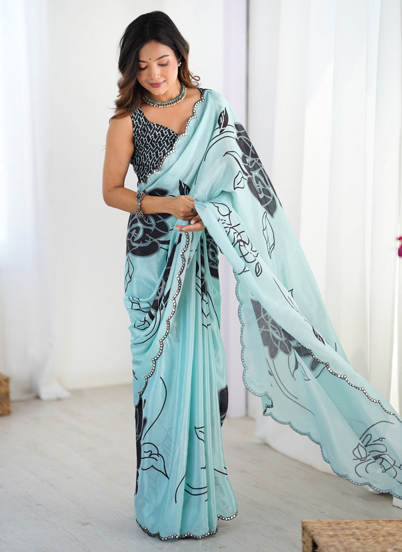 Sky blue Chinon silk designer saree with intricate print and mirror work border.