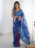 Sophisticated blue Chinon silk saree with a shimmering mirror work border