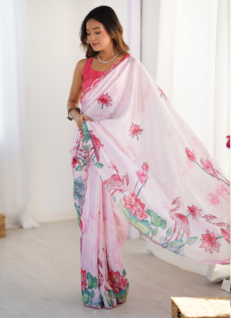Baby girl wearing a baby pink Chinon silk designer saree with a glittery mirror-work border for a festive look.