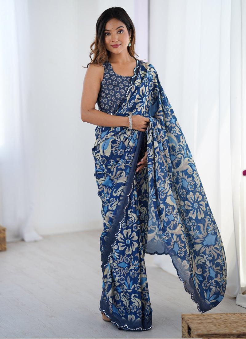 Elegant blue printed Chinon silk saree featuring a detailed mirror work border.