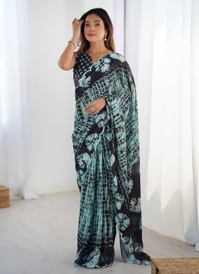 Multi color Chinon silk designer saree with intricate mirror work border detail.