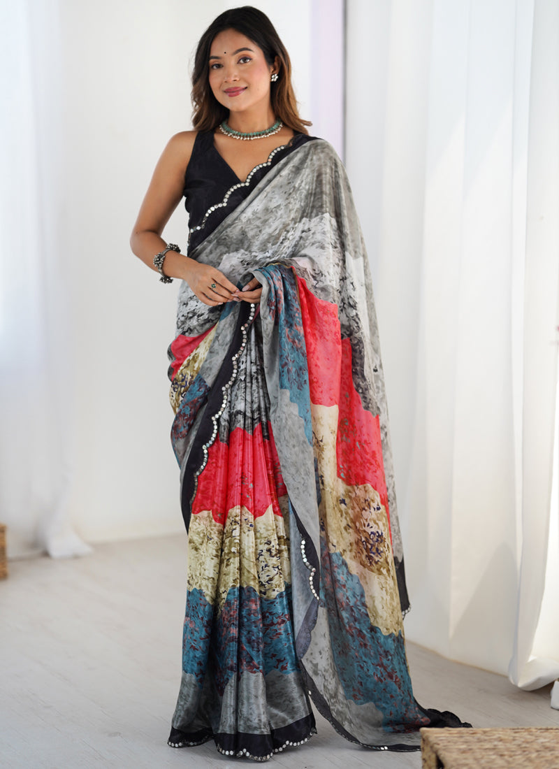 Multi-colored Chinon silk saree featuring an intricate print and mirror-work border