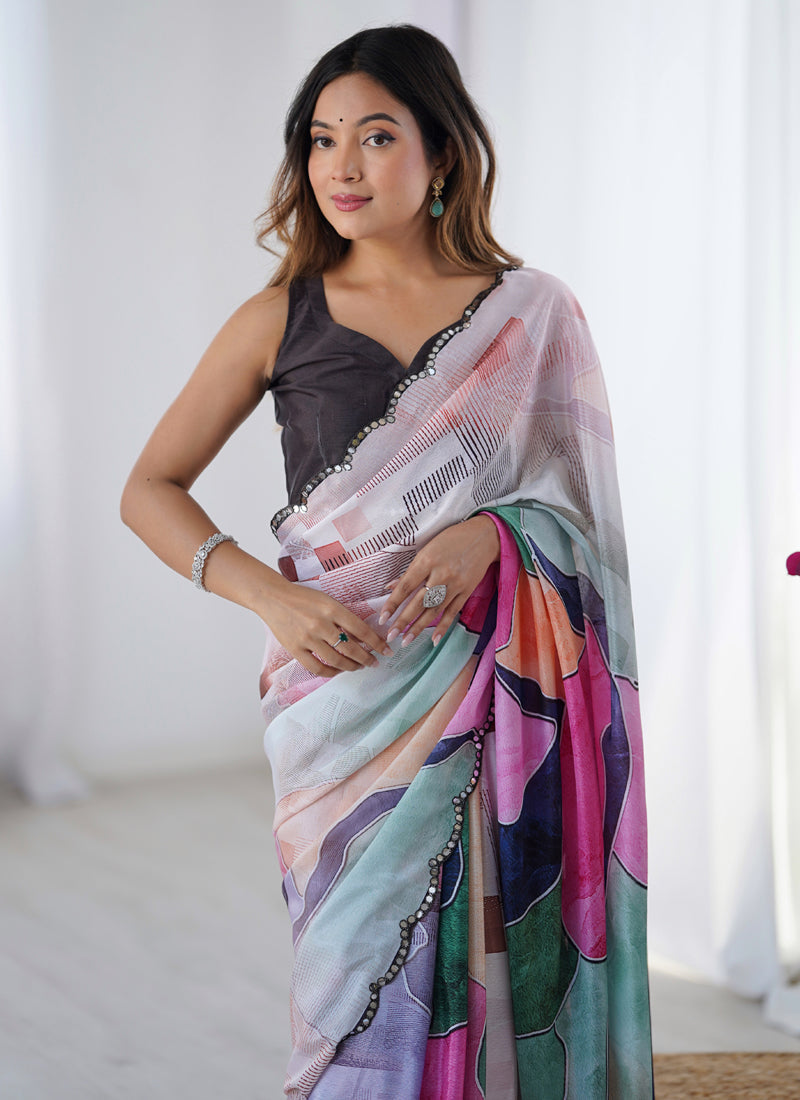 Multi-colored Chinon silk saree with decorative mirror work border and intricate print