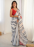 Off White Chinon Silk designer saree with delicate prints and mirror work border