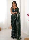 Green smooth Sitara fabric designer saree with heavy Moti and Val sequence lace border