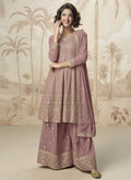 Peach georgette designer palazzo suit with shimmering embroidery and gota patti detailing.
