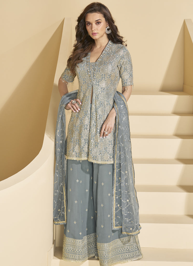 Sophisticated grey georgette palazzo suit with intricate embroidery and gota patti details.