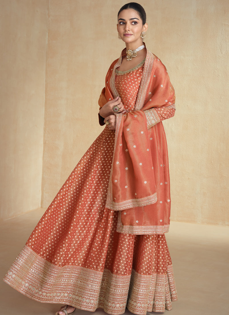 Elegant orange Anarkali suit made from premium viscose jacquard with embroidery.