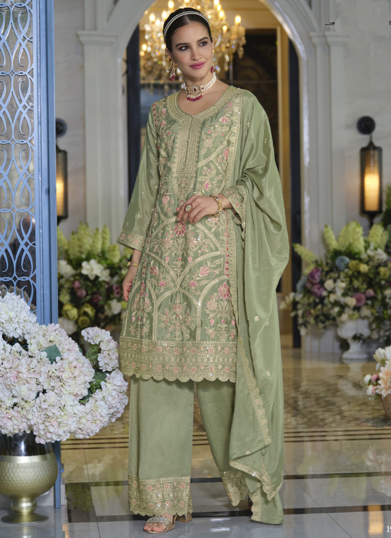 Parrot green Chinon silk palazzo suit with intricate embroidery and gota patti detail.