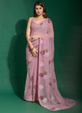 Onion pink georgette saree featuring floral embroidery and sequence work