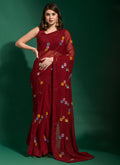 Elegant maroon georgette party wear saree with intricate sequin embroidery and matching blouse